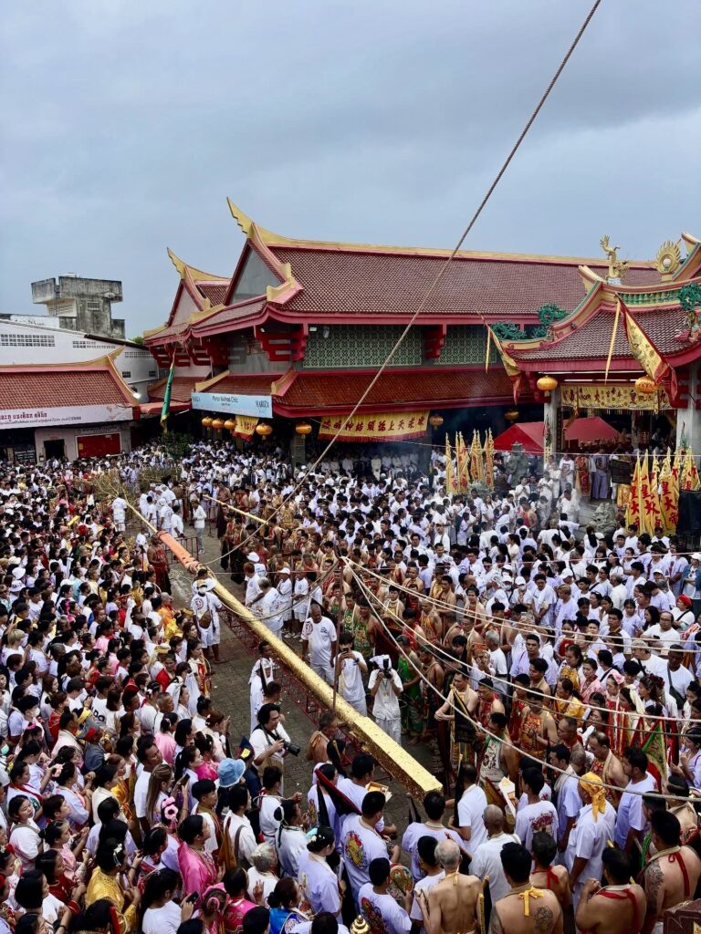Go Teng pole ceremony crowd at a Phuket shrine during the Vegetarian Festival